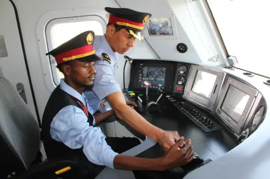 Connecting Addis Abeba with Djibouti-ville, Yaji Railway is the first cross-border electrified railway which uses Chinese construction standard. The Chinese company will be in charge of the first six years’ operation. The picture shows a Chinese train driver is training an Ethiopian staff. Photo by Li Zhiwei from People’s Daily