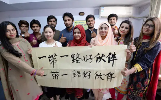 From 2015 to now, a total of 114 students from Pakistan, an important country along the Belt and Road, have come to Hebei Engineering University for studies. To know more and better Chinese culture, they practice in spare time Tai Chi, table tennis, Chinese chess and calligraphy together with their Chinese classmates. In the picture, Chinese and Pakistan students are showing their calligraphy work Good friends along the Belt and Road. Photo by Shi Ziqiang from People’s Daily