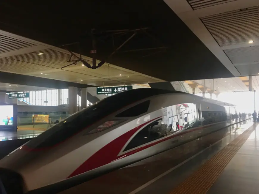 China’s self-developed bullet train, the “Fuxing,” stops at a high-speed railway station in Nanjing, Jiangsu Province. (Photo by Qiang Wei from People’s Daily)