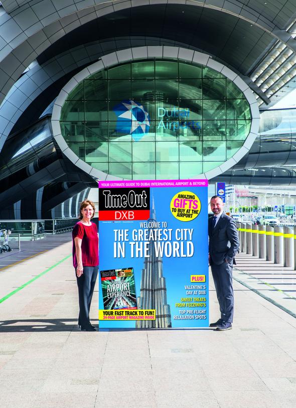 Sue Holt, Executive Director ITP Media Group and Eugene Barry, EVP Commercial at Dubai Airports with a larger than life Time Out DXB front cover (Photo: AETOSWIRE).