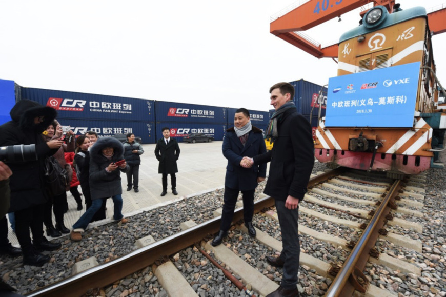 Photo shows the Chinese and Russian operators of a China-Europe freight train who are giving interviews to media. The freight train, loaded with 100 standard containers of small commodities, left Yiwu, Zhejiang province, Jan. 30, 2018. It would travel 10,150 km via Manzhouli, Inner Mongolia Autonomous Region and reach Moscow in about 13 days. (Photo by Gong Xianming from CFP) Photo shows the Chinese and Russian operators of a China-Europe freight train who are giving interviews to media. The freight train, loaded with 100 standard containers of small commodities, left Yiwu, Zhejiang province, Jan. 30, 2018. It would travel 10,150 km via Manzhouli, Inner Mongolia Autonomous Region and reach Moscow in about 13 days. (Photo by Gong Xianming from CFP)