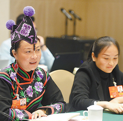 A deputy to the 13th National People's Congress (NPC) from China’s Yunnan province speaks during a panel discussion on the draft revision to China's Constitution, March 7, 2018. (By Chen Bin from People’s Daily)