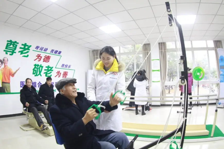 Several old men do physical exercises with the fitness and recovery equipment at a community-based elderly care service center in southwest China’s Chongqing, Jan. 18, 2018. (Photo from CFP)