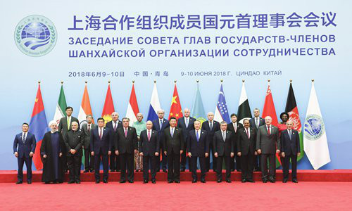 Chinese President Xi Jinping (center) welcomes foreign leaders to the 18th Shanghai Cooperation Organization (SCO) summit and has photos taken with them on Sunday in Qingdao, East China's Shandong Province. Photo: Xinhua Chinese President Xi Jinping (center) welcomes foreign leaders to the 18th Shanghai Cooperation Organization (SCO) summit and has photos taken with them on Sunday in Qingdao, East China's Shandong Province. Photo: Xinhua