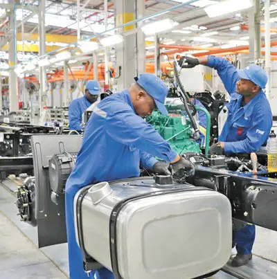 African employees work on an auto production line at a factory of China’s FAW Group in city of Nelson Mandela Bay, South Africa. (Photo by Liu Lingling from People’s Daily)