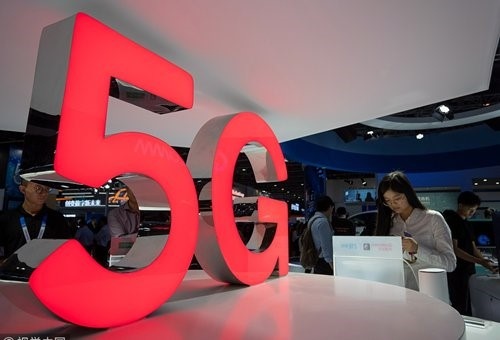 Visitors browse latest information about China's 5G technology at an event held in Guangzhou on March 1st. Photo: CFP Visitors browse latest information about China's 5G technology at an event held in Guangzhou on March 1st. Photo: CFP