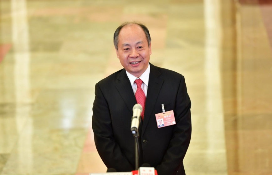 Wang Xiaotao, head of China International Development Cooperation Agency, receives an interview after the opening meeting of the second session of the 13th National Committee of the Chinese People's Political Consultative Conference (CPPCC) at the Great Hall of the People in Beijing, March 3, 2019.