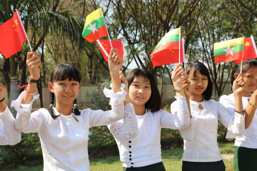 Chinese President Xi Jinping arrived in Nay Pyi Taw on Friday for a state visit to Myanmar. Waving national flags, Myanmar students lined up along the road in the capital city to greet the first Chinese president to pay a state visit to the Southeast Asian country in 19 years. Photo by Sun Guangyong, People’s Daily