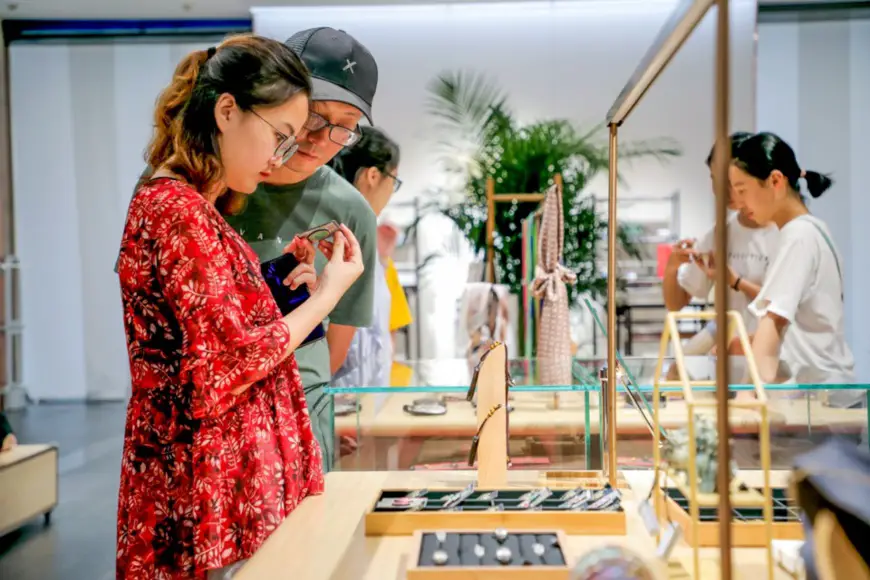 Visitors select cultural and creative products in the shop of Shanxi Bronze Museum. File photo