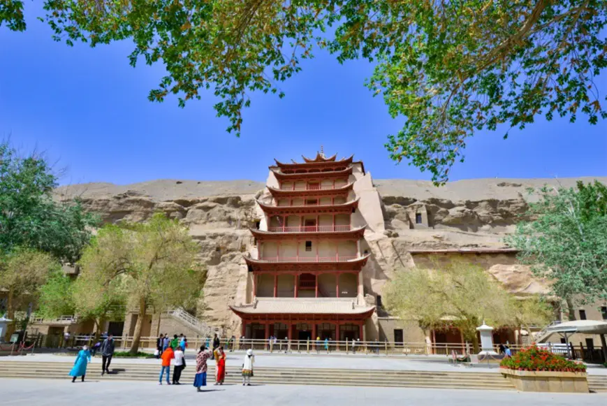 Tourists visit the Mogao Grottoes on May 10, the day it reopens. Photo by Wang Binyin/People’s Daily Online