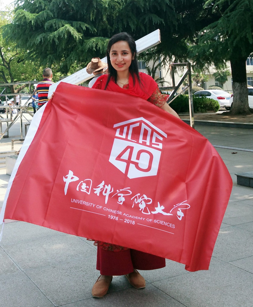 Noor-ul-Huda holds a banner of University of Chinese Academy of Sciences. Photo: Courtesy of Noor-ul-Huda