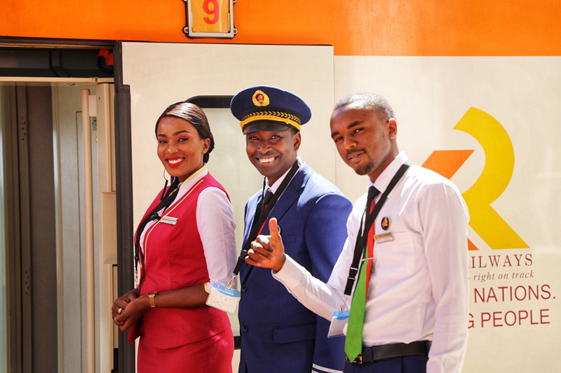 Crew members of a train running between Nairobi and Malaba wait for passengers to board. Photo by Lyu Qiang, People's Daily