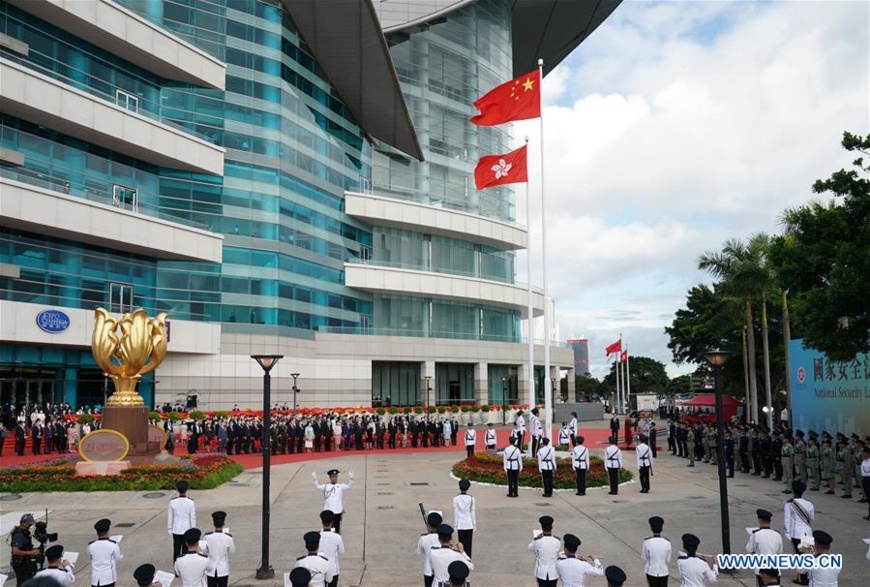 A flag-raising ceremony is held by the government of the Hong Kong Special Administrative Region to celebrate the 23rd anniversary of Hong Kong's return to the motherland at the Golden Bauhinia Square in Hong Kong, south China, July 1, 2020. (Xinhua/Li Gang)