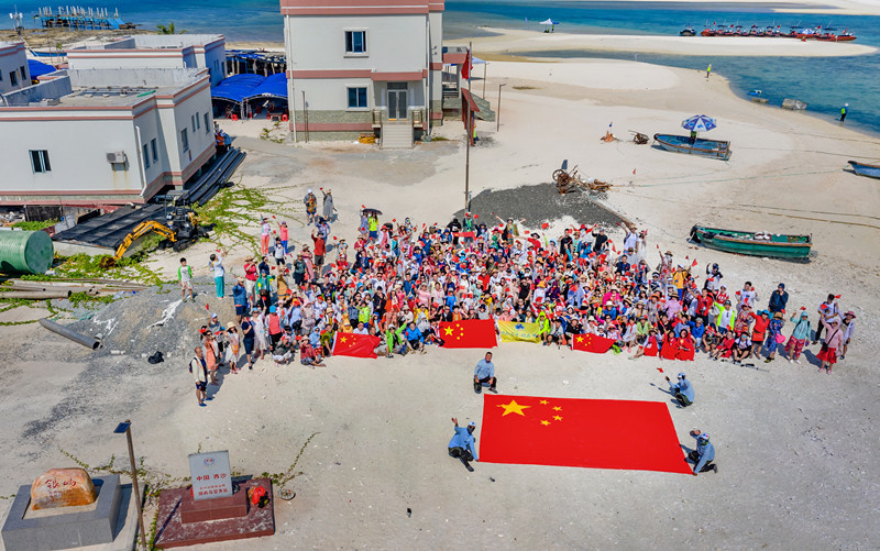 Photo taken in October 2019 shows Yinyu Island located north of Yongle Islands, Xisha Islands in the South China Sea. The island is made of coral sand and reefs, and is considered the most beautiful island among Yongle Islands. It boasts a good eco-system, and is home to many kinds of creatures such as crabs, shells, fish and pagurians. On the island, there are a neighborhood committee, a flagpole and some makeshift houses for casual stays of fishermen. (Photo by Liu Guoxing/People’s Daily Online)