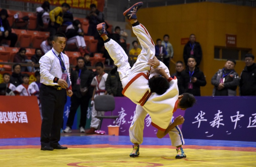 Two athletes compete in a Chinese wrestling game held in Handan, north China's Hebei province. People's Daily Online/Hao Qunying