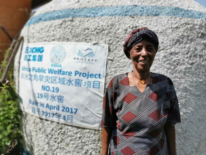 A local woman in Ghadaig Town, Amhara region, Ethiopia, takes a photo in front of a Chinese-funded water cellar. (Photo/Courtesy of XCMG) A local woman in Ghadaig Town, Amhara region, Ethiopia, takes a photo in front of a Chinese-funded water cellar. (Photo/Courtesy of XCMG)