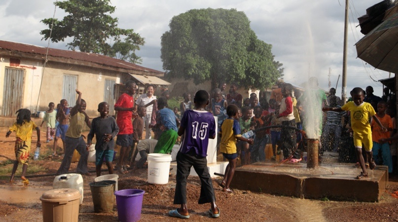 Children play around a well in Kwali, Nigeria when CGCOC employees clean the well. Photo: courtesy of the CGCOC