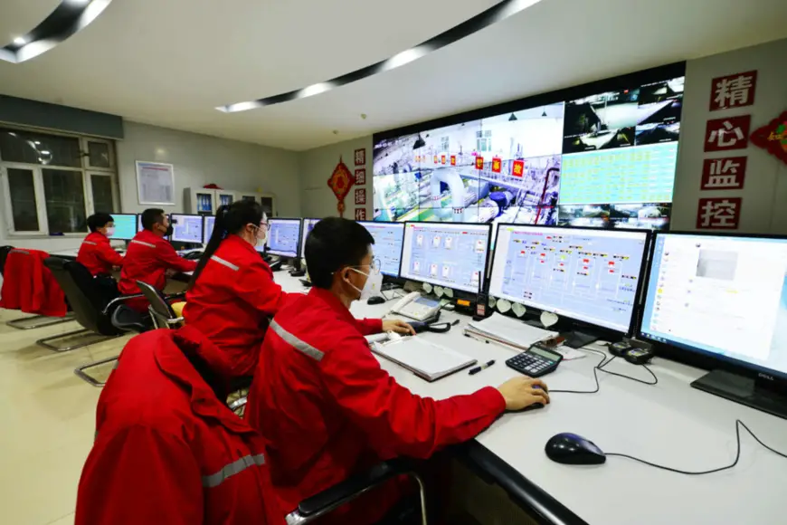 Workers remotely monitor the production process at a production base of China Petrochemical Corporation in Aksu City, Northwest China’s Xinjiang Uygur Autonomous Region, March 3. Photo by Shi Libin/People’s Daily