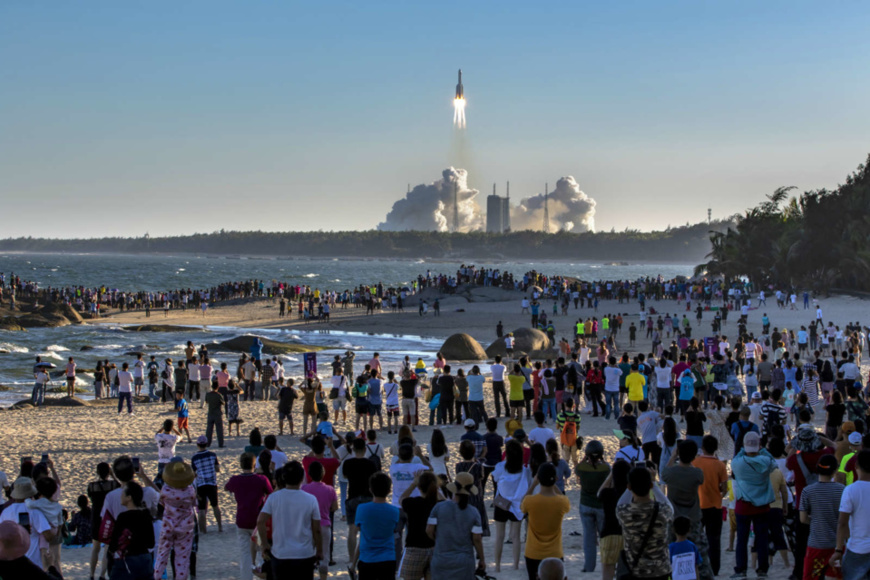 Visitors watch the launching of Long March-5B carrier rocket near the Wenchang Space Launch Center, south China’s Hainan province, May 5. (Photo by Chen Yun/People’s Daily Online) Visitors watch the launching of Long March-5B carrier rocket near the Wenchang Space Launch Center, south China’s Hainan province, May 5. (Photo by Chen Yun/People’s Daily Online)