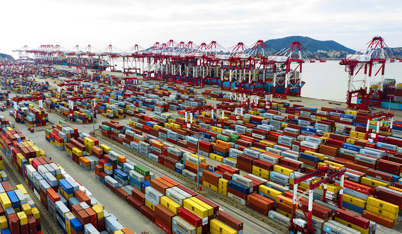 Vessels are being unloaded at a terminal of Yangshan Deep Water Port, Shanghai, Oct. 25. Many of the vessels carry the products to be exhibited at the third China International Import Expo. Photo by Ji Haixin/People's Daily Online