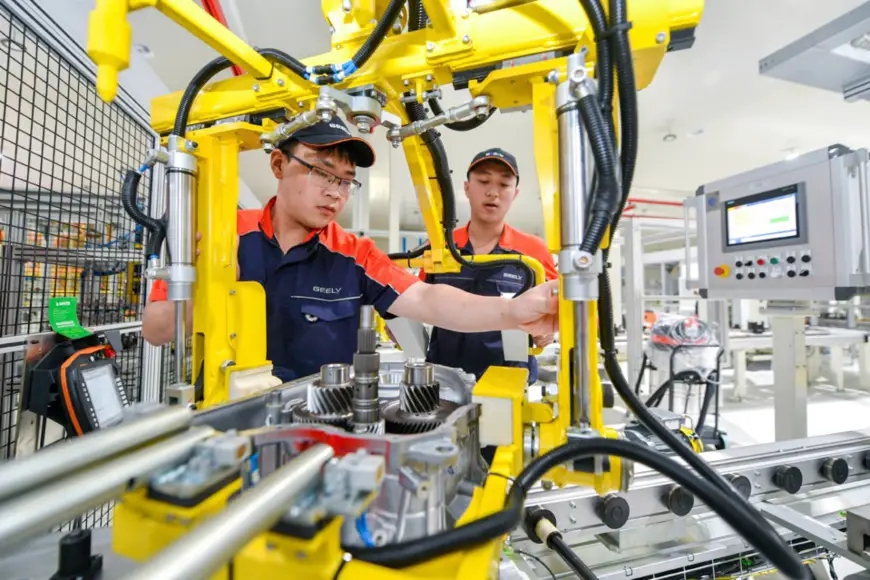 Wet dual clutch DCT transmissions independently developed by China's automaker Geely are under trial production at the brand's manufacturing base in Changxing, east China's Zhejiang province. Photo by Tan Yunfeng, People's Daily Online