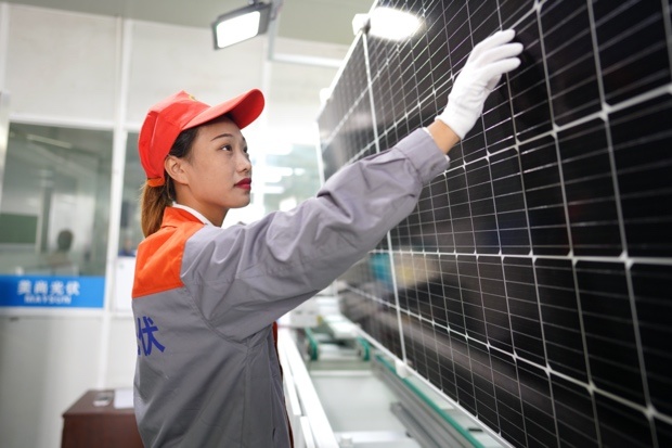 Photovoltaic panels are being fabricated at ZheJiang Maysun solar Co., Ltd. in Huzhou, east China's Zhejiang province, Oct. 14, which are expected to shipped to Germany. Photo by Zhang Bin/People's Daily Online Photovoltaic panels are being fabricated at ZheJiang Maysun solar Co., Ltd. in Huzhou, east China's Zhejiang province, Oct. 14, which are expected to shipped to Germany. Photo by Zhang Bin/People's Daily Online