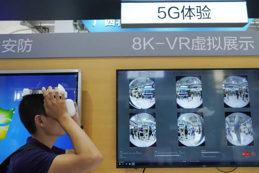 A man experiences 8K livestream videos powered by 5G at Chinese tech giant Huawei's exhibition booth during the China-ASEAN AI Summit held in Nanning, south China's Guangxi Zhuang autonomous region, Sept. 7, 2019. Photo by Yu Xiangquan/People's Daily Online
