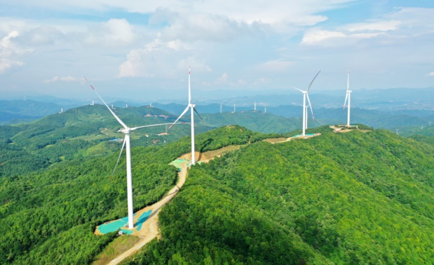 Photo taken on June 4th, shows the beautiful scene formed by wind turbines in Ganzhou City, East China’s Jiangxi Province. Photo by Chen Dichang/People’s Daily Online Photo taken on June 4th, shows the beautiful scene formed by wind turbines in Ganzhou City, East China’s Jiangxi Province. Photo by Chen Dichang/People’s Daily Online