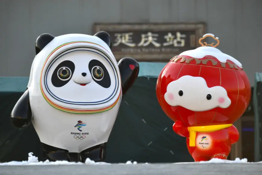 Beijing 2022 Winter Olympic and Paralympic mascots stand in front of the Yanqing station of Beijing-Zhangjiakou High-speed Railway, a key infrastructure project for the Beijing 2022 Olympic Winter Games that starts operation on Dec. 1. Photo by Sun Lijun/People’s Daily Online