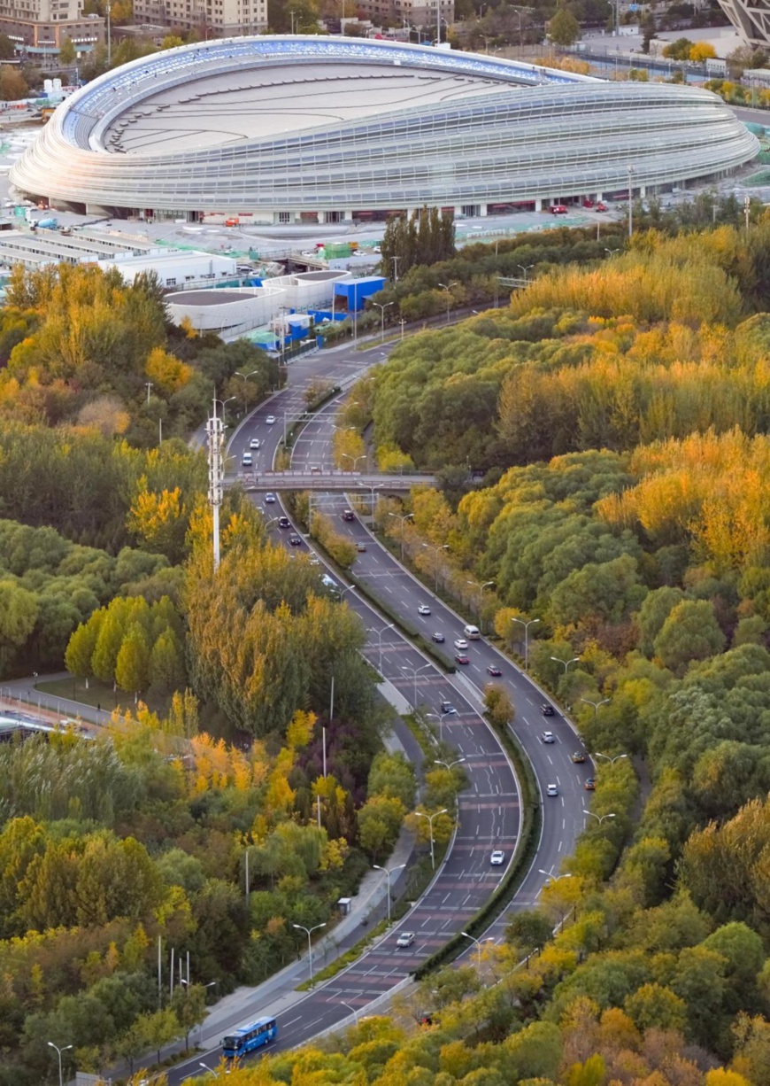 Photo taken on Oct. 23, 2020, shows the National Speed Skating Hall, a venue under construction for the Beijing 2022 Olympic and Paralympic Winter Games. (Photo by Liu Shuaiye/People's Daily Online)