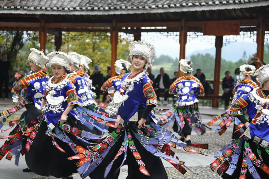 Performers and villagers dance for tourists in Nanhua village, Sankeshu Township, Kaili, Qiandongnan Miao and Dong Autonomous Prefecture, southwest China's Guizhou Province, Nov. 20, 2020. (Photo by Cai Xingwen/People's Daily Online)