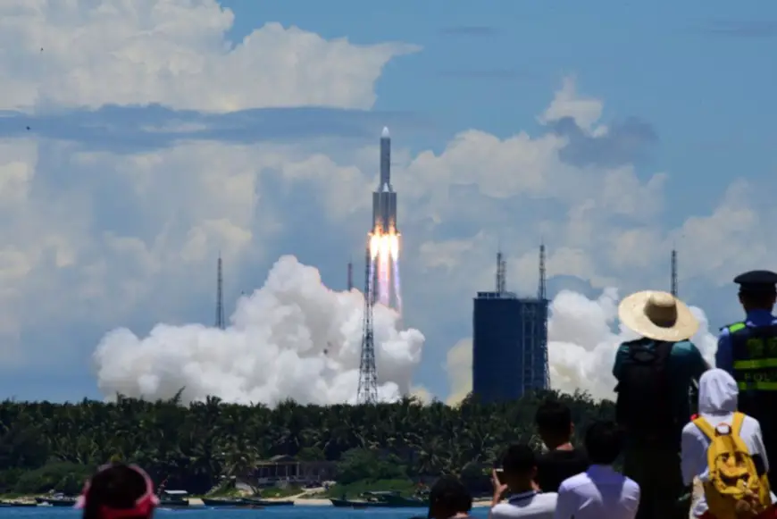 Photo taken on July 23, 2020, shows people watching China’s Tianwen-1 Mars probe being launched from Wenchang Spacecraft Launch Site in south China’s Hainan province. (Photo by Meng Zhongde/People’s Daily Online)