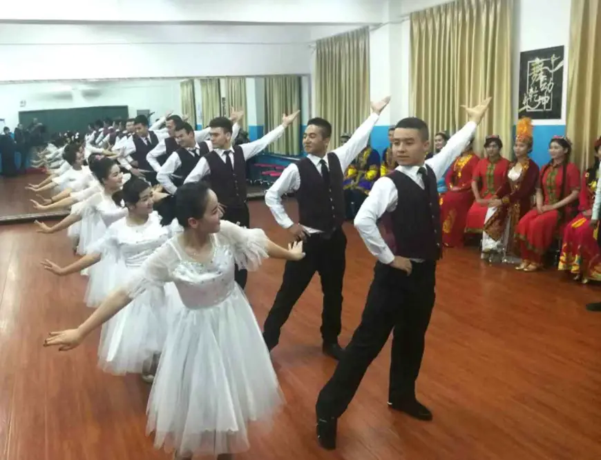 Trainees dance in a vocational education and training centre in Xinjiang. (Photo by Muhammad Asghar)