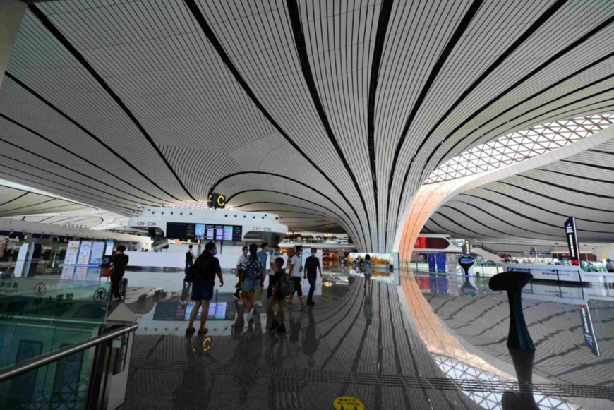 Photo taken on July 30, 2020 shows that passengers walk at Beijing Daxing International Airport. Photo by Fan Jiashan/People’s Daily Online Photo taken on July 30, 2020 shows that passengers walk at Beijing Daxing International Airport. Photo by Fan Jiashan/People’s Daily Online