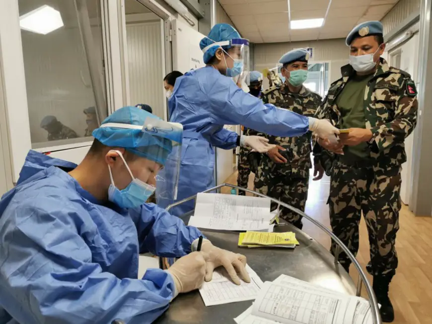 Peacekeepers of the UN Interim Force in Lebanon line up to get vaccinated against COVID-19 at a medical unit of the Chinese peacekeeping forces to Lebanon, June 28, 2021. (Photo by Lei Yang, Jia Fangwen/People’s Daily Online)