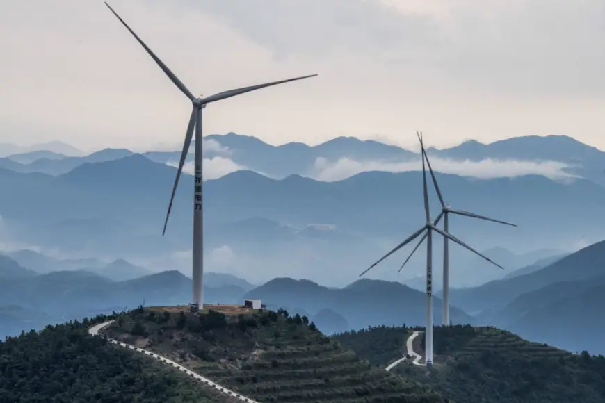 Photo taken on July 10, 2021, shows a wind farm in Panfeng township, Pan’an county, Jinhua city, east China’s Zhejiang province. (Photo by Chen Yueming/People’s Daily Online)