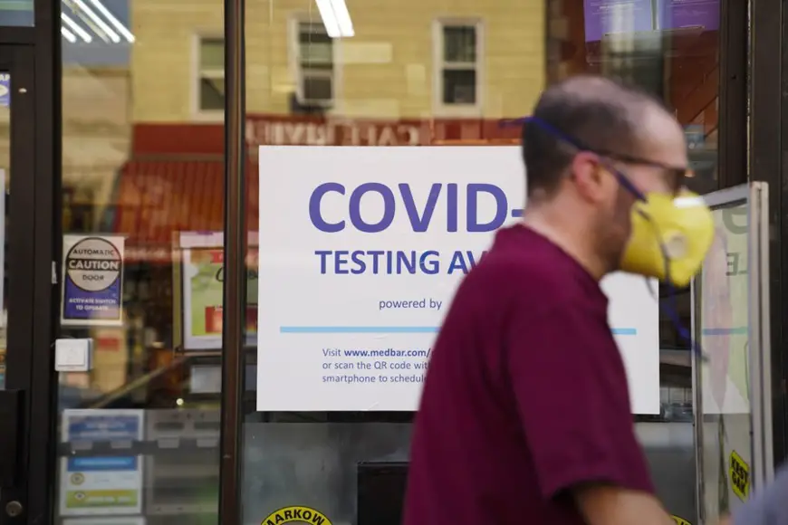 A pedestrian walks past a COVID-19 testing billboard in New York, the United States, July 26, 2021. (Xinhua/Wang Ying)