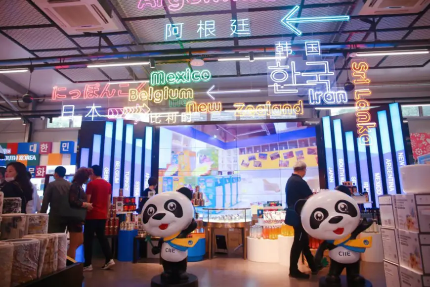 Photo taken on June 14, 2021, shows a market selling products introduced to China through the China International Import Expo at Nanjing road, Shanghai. (Photo by Chen Yuyu/People’s Daily Online)