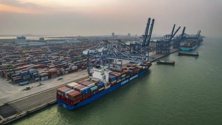 Containers are loaded onto a cargo ship at a terminal in Nansha district, Guangzhou, capital of south China’s Guangdong province, Sept. 12, 2021. (Photo by Ye Bingxin/People’s Daily Online)