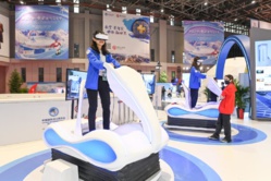 Visitors experience skiing on VR machines at the 4th China International Import Expo (CIIE) on Nov. 6, 2021, the second day of the event. (Photo by Jiang Yushi/People’s Daily)