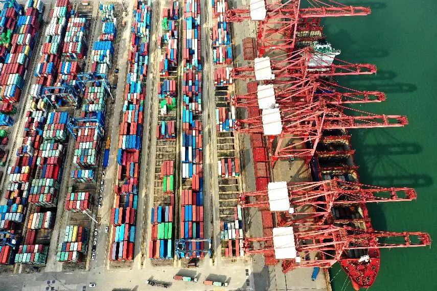 An ocean-going vessel is loading at the container terminal of Lianyungang Port in Lianyungang city, east China’s Jiangsu province, Oct. 13, 2021. (Photo by Wang Chun/People’s Daily Online)