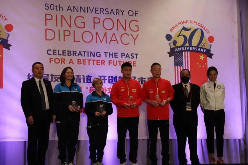 The older generation of Chinese and U.S. ping-pong players are awarded for their contribution to the China-U.S. Ping-Pong Diplomacy during a commemorative activity marking the 50th anniversary of the Ping Pong Diplomacy held in Houston, the U.S., on Nov. 23, 2021. (Photo by Zhang Mengxu/People’s Daily Online)