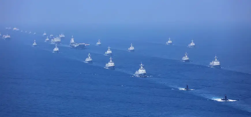 The aircraft carrier Liaoning, submarines, vessels and fighter jets take part in a review in the South China Sea on April 12, 2018. (Xinhua/Mo Xiaoliang)