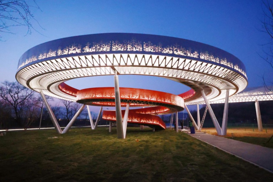 A landmark installation called “Ring of Winter Olympics” is being tested in the Beijing Olympic Winter Park, Dec. 22, 2021. (Photo by Chen Xiaogen/People’s Daily Online)