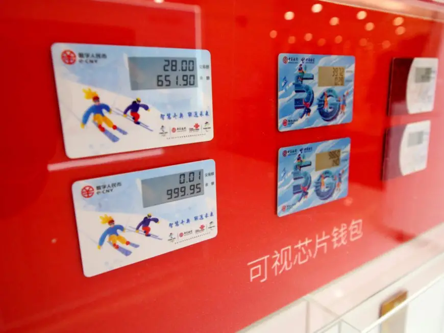 Digital ATM cards are on display at an exhibition held to showcase the pilot of digital yuan during the upcoming Winter Olympics in Beijing, Oct. 21, 2021. (Photo by Du Jianpo/People’s Daily Online)
