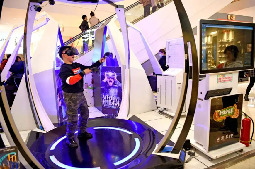 A child tries virtual reality (VR) devices at a mall in Huainan city, east China’s Anhui province, Feb. 14, 2021. (Photo by Chen Bin/People’s Daily Online)