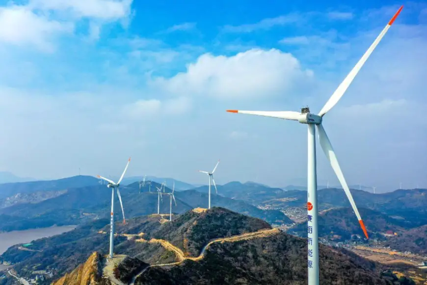 Photo taken on Jan. 8, 2022, shows wind turbines on Qushan island, Daishan county, Zhoushan city, east China’s Zhejiang province. (Photo by Yao Feng/People’s Daily Online)