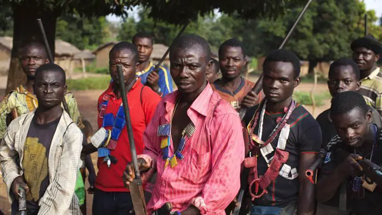 Militia fighters known as anti-balaka pose for a photograph in Mbakate village, Central African Republic on November 25, 2013. REUTERS/JOE PENNEY