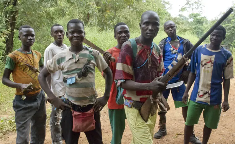 Fighters from a Christian militia known as the anti-balaka have emerged to defend towns and in some cases attack Muslim communities. These men display their makeshift weaponry in Boubou, Central African Republic, on Nov. 26. Florence Richard