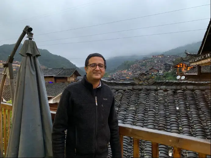 Bhaskar Koirala, the Director of Nepal Institute of International and Strategic Studies, visits an ethnic village in southwest China’s Guizhou province in 2017. (Photo provided by Bhaskar Koirala)
